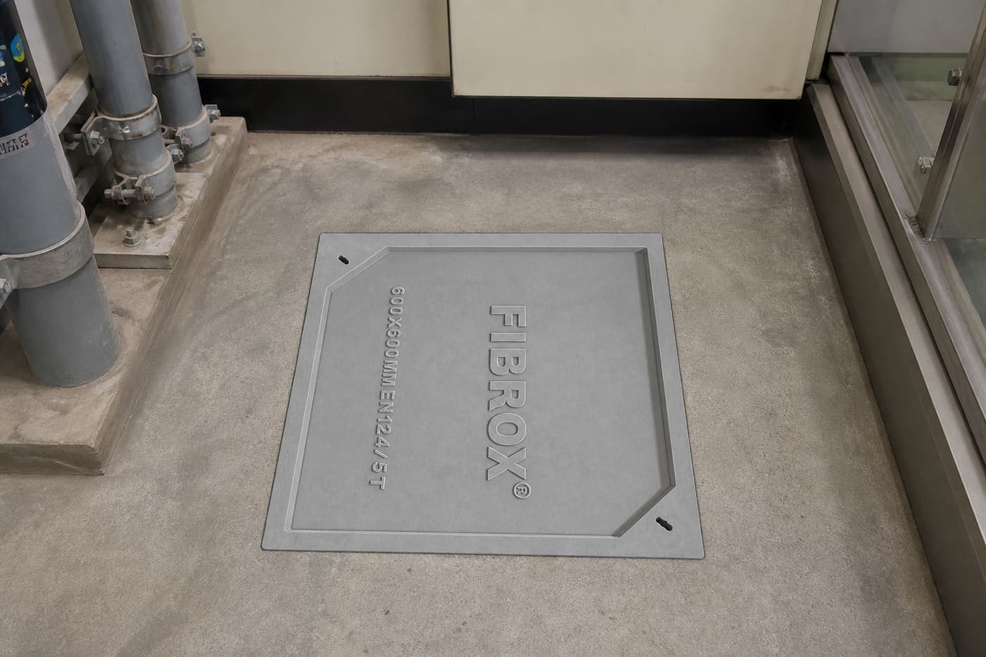 Fibrox FRP product — Manhole cover installed in tech park utility corridor floor